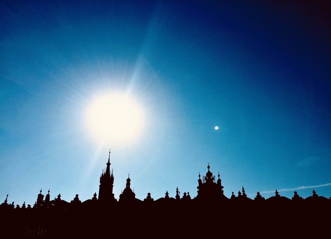 LOW ANGLE VIEW OF SILHOUETTE BUILDINGS AGAINST SKY