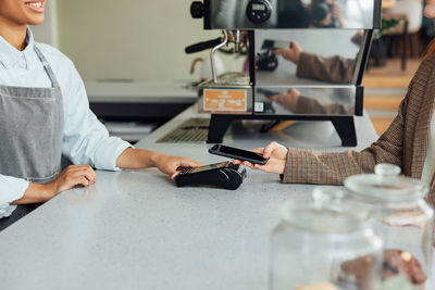 Midsection of man working at table