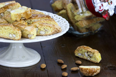 Sliced homemade cake served on wooden table