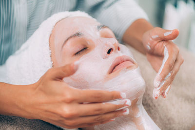 Close-up of woman getting massage therapy at spa