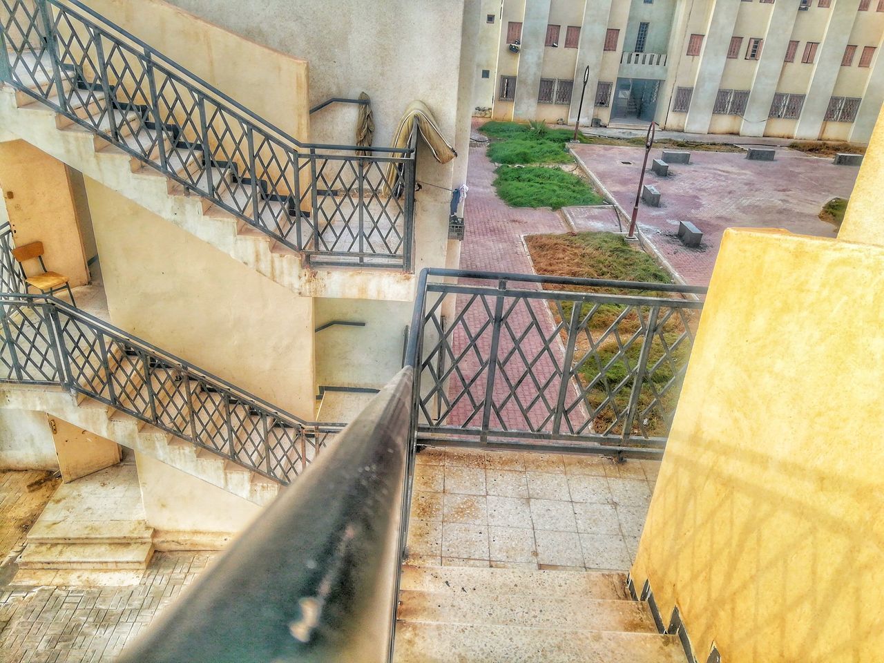 HIGH ANGLE VIEW OF STEPS AND BUILDING