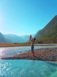 Father and child in beautiful mountain terrain norway