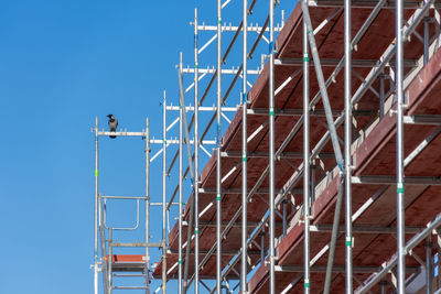 Low angle view of building against blue sky