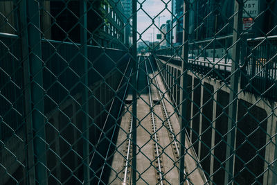 Full frame shot of chainlink fence against building