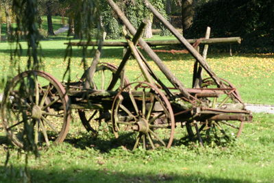 Old wooden structure on grassy field