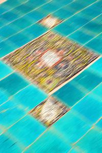 High angle view of swimming pool against blue background