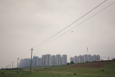 Panoramic view of buildings in city against sky