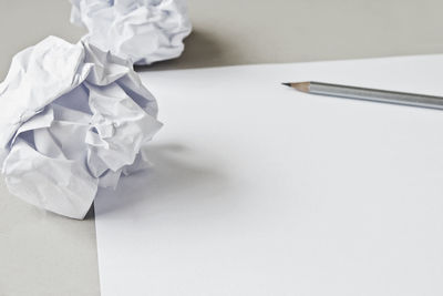 High angle view of white paper on table