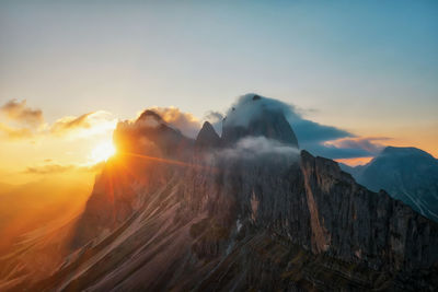 Scenic view of mountains against sky during sunset