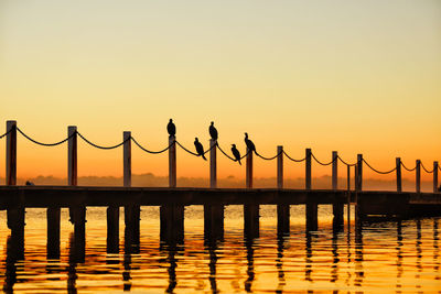 Scenic view of sea against orange sky