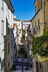 Houses in town against clear sky