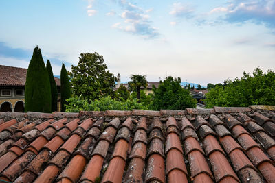 Low angle view of roof and houses against sky