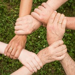 Low section of couple holding hands