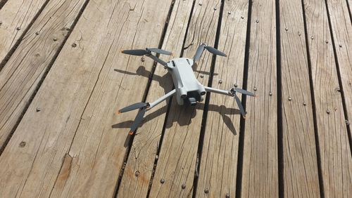 High angle view of drone on wooden floor