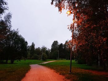 Trees on field against sky during autumn