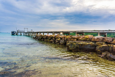 Pier over sea against sky