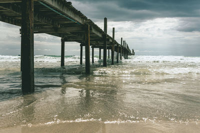 Pier over sea against sky