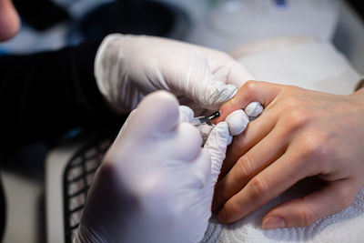 Midsection of doctor examining patient