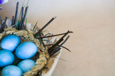 High angle view of multi colored eggs on table