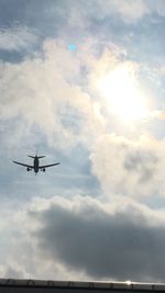 Low angle view of airplane flying in sky