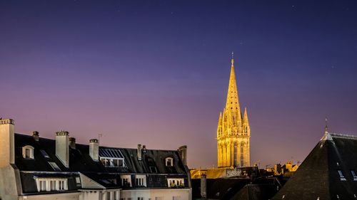 Low angle view of buildings against blue sky