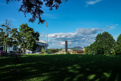 Trees and built structure against sky