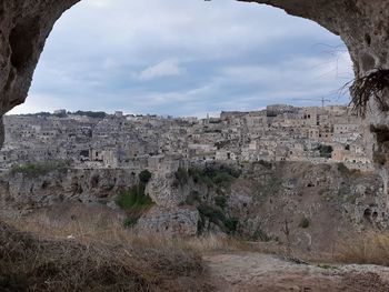 Old ruins of building against cloudy sky