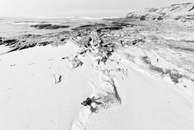 Scenic view of sea against sky during winter