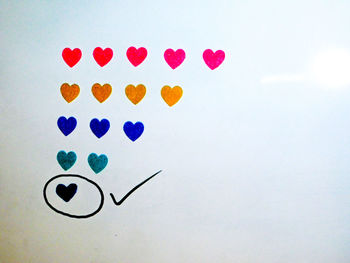 Close-up of heart shape made of multi colored paper