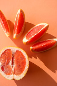 Close-up of red chili pepper against colored background