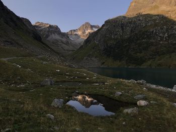 Scenic view of lake and mountains against sky