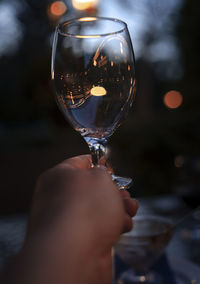 Close-up of hand holding wineglass