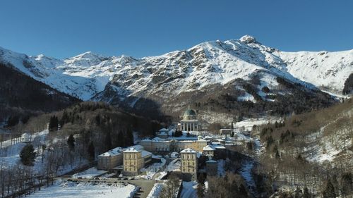 Scenic view of snowcapped mountains against clear sky