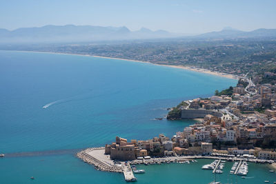 High angle view of city by sea