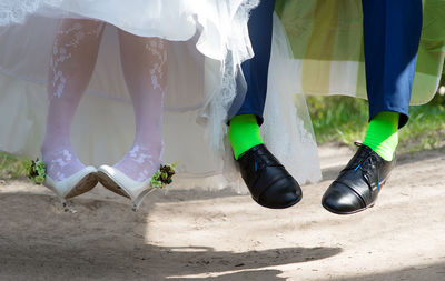 Low section of man wearing shoes