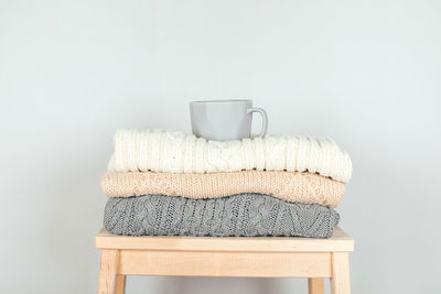 Close-up of coffee cup on table against white background