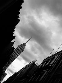 Low angle view of building against cloudy sky