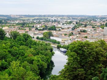 High angle view of townscape and trees against sky