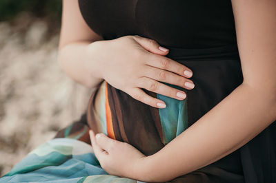 Close-up of woman holding hands