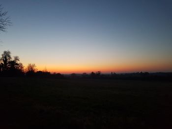 Scenic view of silhouette landscape against clear sky during sunset