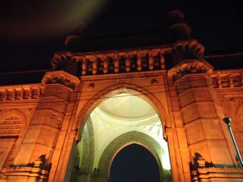 Low angle view of illuminated building at night