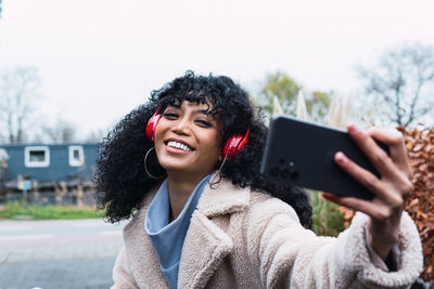 Young woman using mobile phone