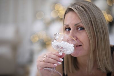Close-up of woman drinking glass