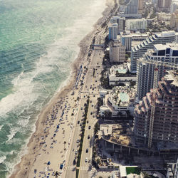 High angle view of city by sea