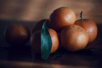 Close-up of oranges on table