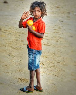 Boy standing on beach