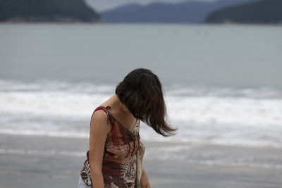 Woman standing at beach