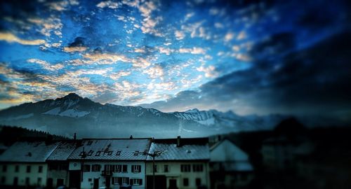 Scenic view of mountains against cloudy sky