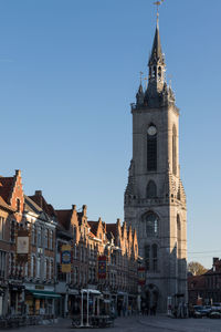 View of buildings in city against clear sky