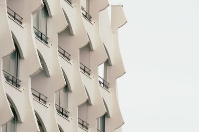 Low angle view of buildings against white background